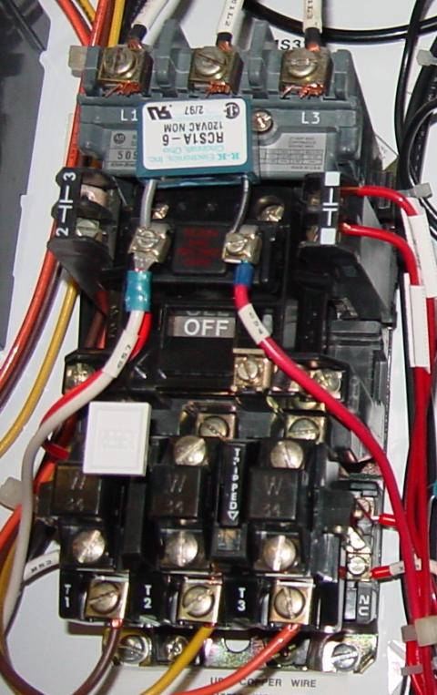 480 volt relay with the 3 heaters at the bottom.  That white square is an overload reset button. in front of the first heater
