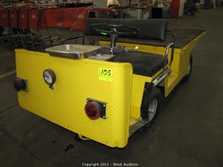 A yellow electric Cushman cart like this