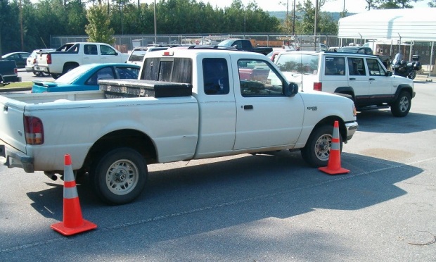An AT&T safety demonstration of placing cones around a truck